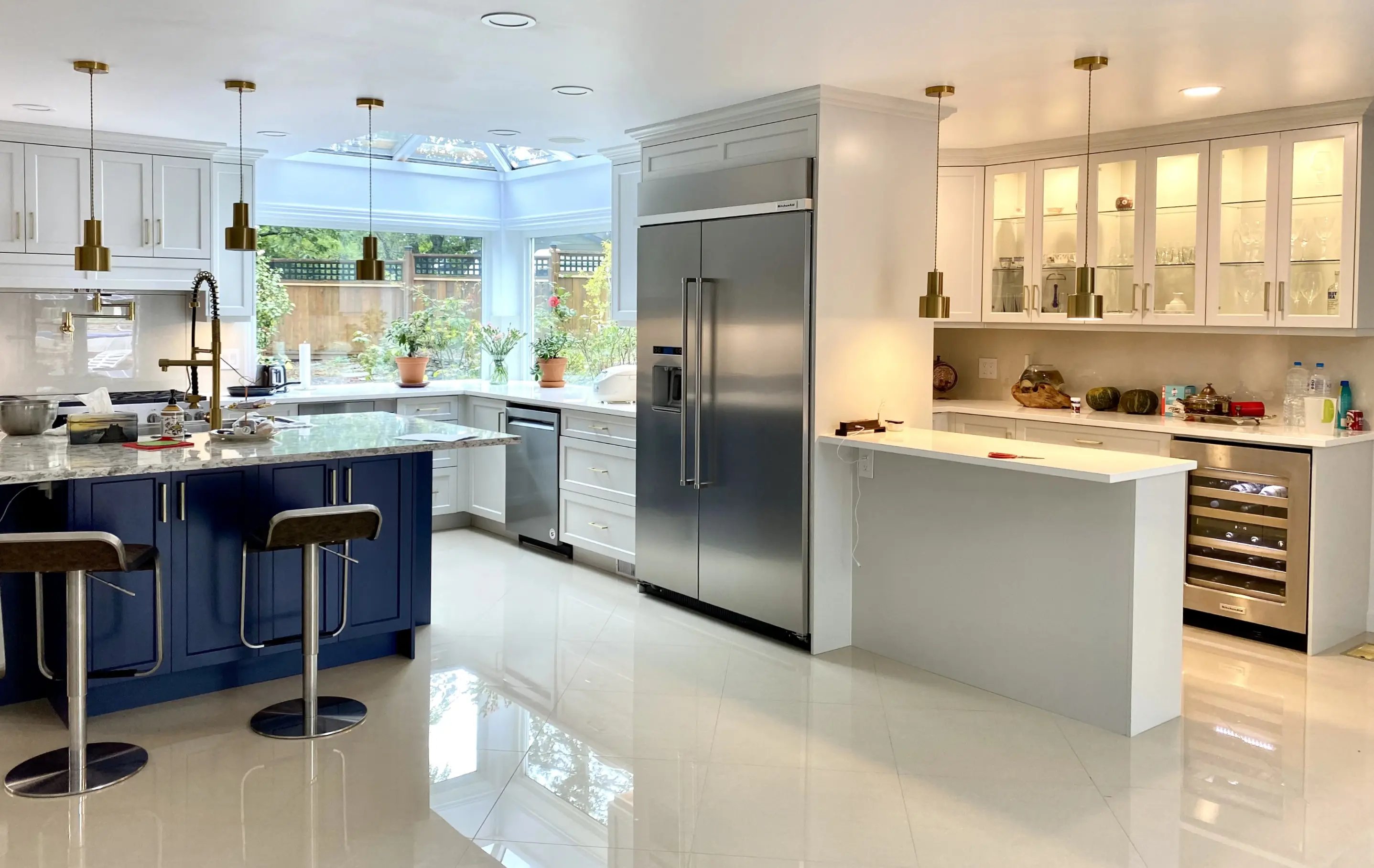 Custom kitchen with blue island by Top Choice Cabinets