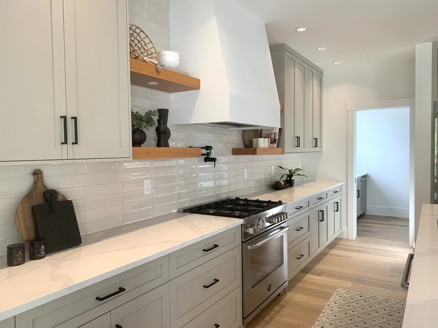 Gray shaker kitchen with range hood